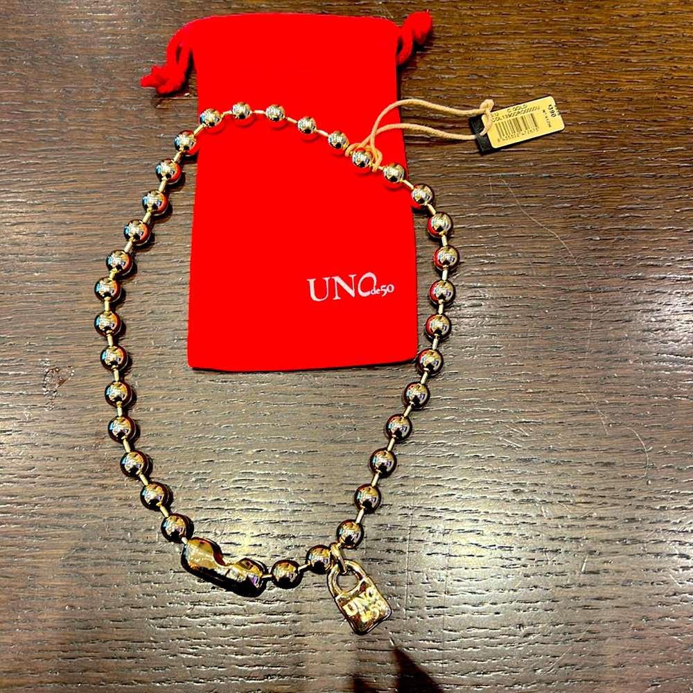Gorgeous necklace by UNOde50. 18K gold plated . Could be worn day to night.